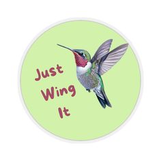 a hummingbird flying through the air with words just wing it