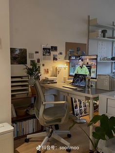 an office with a desk, chair and computer monitor