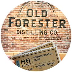 an old forester distilling co sign with two tickets