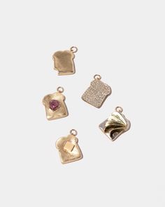 Item Details 0.13 ct. combined weight of twenty-six round brilliant cut, purple diamonds Set in 14k rose gold 'jelly' 'Toast' cast in solid 14k yellow gold Each charm measures approximately 15mm long and 12mm wide Charm includes 4mm seamless jump ring If you would prefer to receive your charm with an open jump ring to allow for easy addition to a chain of your own, please indicate at time of order If you choose to receive your jump ring opened, we do recommend having it professionally closed to Foods Breakfast, Buttered Toast, Solid Gold Charms, Cartier Panthere, Purple Diamond, Necklace Ideas, Dope Jewelry, Diamond Charm