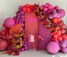 a flamingo themed birthday party with balloons and flowers