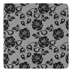 a black and white floral pattern on a mesh net background stock photo - budget conscious