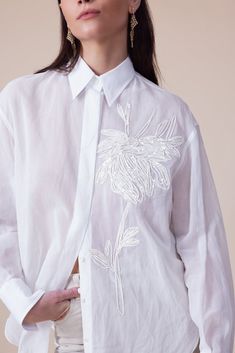 Brunello Cucinelli long sleeve magnolia blouse in white. 100% Cotton Dry Clean Made in IT Luxury Long Sleeve Blouse With Embroidered Cuffs, Luxury Long Sleeve Blouse With Embroidery, Luxury Embroidered Hem Blouse For Spring, Luxury Women's Blouse With Embroidered Cuffs, Luxury Chic Blouse With Pearl Embroidery, Luxury Elegant Blouse With Placement Embroidery, Luxury Embroidered Blouse For Daywear, Designer Luxury Cotton Blouse, Luxury Designer Spring Blouse