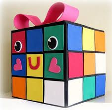 a box made out of colored blocks with the word u painted on it's side