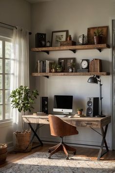 a desk with a computer on top of it in front of a window next to a potted plant