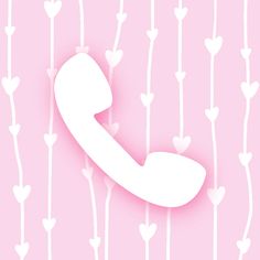 a phone with hearts hanging from it's sides on a pink and white background