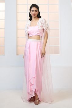 Pink draped skirt with embroidered waistband. Paired with pleated bustier and embroidered draped cape. - Aza Fashions Fitted Sets With Pearl Embroidery And Traditional Drape, Hand Embellished Draped Wedding Set, Draped Sequin Sets For Wedding, Draped Sequin Wedding Set, Draped Wedding Sets With Sequins, Pre-draped Set With Sheer Dupatta For Reception, Hand Embellished Fitted Sets With Cape Sleeves, Fitted Sets With Hand Embellished Cape Sleeves, Fitted Hand-embellished Sets With Cape Sleeves