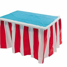 a red and white striped table cover with blue linings on the top, sitting in front of a white backdrop