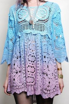 a woman wearing a blue and purple crochet dress