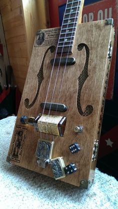 an electric guitar made out of wood and magnets on the back of it's body