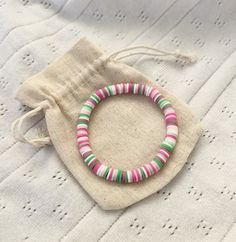 This beautiful handmade bracelet makes for the perfect accessory! Made of durable 6mm clay beads, this bracelet is lightweight and suitable for everyday wear. The design consists of various shades of pink and green to create a watermelon-inspired pattern. It makes for the perfect beachy gift for friends and family, or for treating yourself (you deserve it <3). Every order comes with freebie stickers.  FREE SHIPPING WHEN YOU BUY 4 OR MORE ITEMS WITH CODE: FREESHIPPING For any questions, concerns, Bracelet Clay Bead, Watermelon Bracelet, Bracelet Clay, Freebie Stickers, Beachy Bracelets, Clay Bead Bracelet, Clay Bead, Bracelet Ideas, Handmade Bracelet