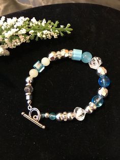 Handmade beaded bracelet with toggle closure. 8 inches in length. Adjustable Beaded Bracelets With Toggle Clasp, Toggle Bracelet, Bracelets Handmade Beaded, Last Minute Gifts, Silver Beads, Blue And Silver, Beaded Bracelet, Jewelry Bracelets, Etsy Accessories