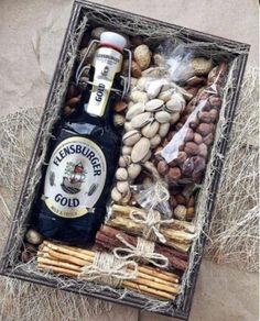 a bottle of beer and some nuts in a box