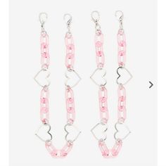 three pairs of pink and silver chain earrings with heart charms on each side, one in the