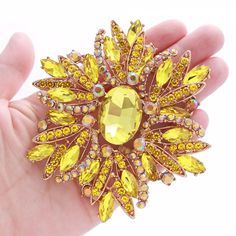 Gorgeous large rhinestone brooch with bright yellow crystals, which can be used for your DIY project - dress accessory decoration, wedding, cake and pillow decorations, clutch decor, crafts, scrap booking. jewelry gift and much more! Size: 4 inch high 3 1/4 inches wide Stone color: Yellow and AB (iridescent) Metal: rose gold plated This yellow crystal brooch can be ordered with pin in the back to add to your gown or dress sash, to wire into brooch bouquet, or any number of other craft projects; or without the pin as a flat back embellishment for your sew-on, glue-on DIY project. More YELLOW brooches - https://www.etsy.com/shop/Crystalitzy?section_id=28737129 Please note that this crystal rhinestone embellishment has flat backing, it is suitable only for your sew-on or glue-on DIY project h Yellow Crystals, Crystal Yellow, Gemstone Brooch, Yellow Gemstones, Dress Sash, Brooch Bouquet, Dress Pin, Diamond Brooch, Star Gift