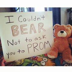 a teddy bear sitting next to a sign that says i couldn't bear not to ask you to prom