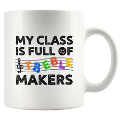 a white coffee mug with the words my class is full of treble makers