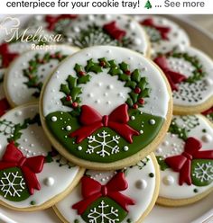 decorated cookies on a plate with bows and snowflakes in the center for your cookie tray