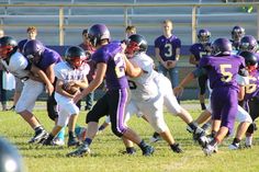 a group of young men playing a game of football