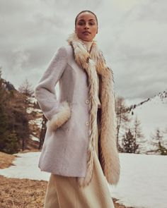 Enjoy the smooth durability and style of shearling while indulging your decadent side. Made of incomparably warm and supple Spanish Merino shearling sheepskin. #overlandsheepskin #winterlooks #luxurycoat #winterstyle #womenscoat Elegant Long Sheepskin Coat, Elegant Long Shearling Coat, Elegant Shearling Outerwear For Fall, Elegant Fall Shearling Outerwear, Elegant Shearling Outerwear With Faux Fur Trim, Elegant Sheepskin Fur Coat For Winter, Elegant Mink Shearling Fur Coat, Elegant Mink Colored Shearling Outerwear, Elegant Mink Shearling Outerwear