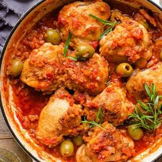 chicken and olives in tomato sauce with fresh herbs