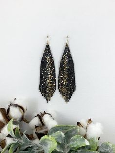 Black and gold galaxy beaded earrings, statement boho earrings, unique earrings, Christmas gift for herLength 5” including ear wireWidth 1”Made with best quality Japanese seed beads and 24k gold dipped seed beadsLightweight and unique extravagant style - designed and made by Luba RoColors used - black, gold, metallic iris blueSelect closure earwiresleverbacksclip-ons for non pierced ears Festive Drop Earrings With Gold Beads, Gold Beaded Drop Earrings For Party, Gold Nickel-free Beaded Earrings For Party, Gold Beaded Earrings With Ear Wire For Party, Gold Beaded Earrings With Dangling Beads For Festive Occasions, Dangle Jewelry With Gold Beads For Party, Handmade Gold Beaded Earrings For Party, Festive Gold Beaded Dangling Earrings, Handmade Gold Chandelier Earrings For Party