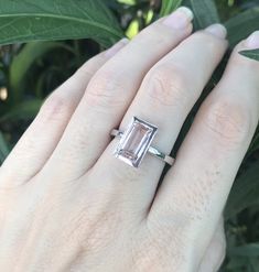 "A stunning north south setting featuring a rectangle shaped genuine flawless Morganite from Brazil is bezel set with a polish finish makes a lovely engagement/promise/statement ring. Wrapped in a box ready for gift-giving. Morganite measure 9.5mm x 6mm ---> Don't know your ring size? Purchase our ring sizing gauge https://www.etsy.com/listing/290720637/ring-sizer-ring-sizing-gauge-multisizer?ga_search_query=ring+sizer&ref=shop_items_search_1 *Follow us @belesasjewelry on Instagram for pr Classic Emerald Ring With Rectangular Bezel Setting, Anniversary Emerald Ring With Bezel Setting, Formal Emerald Ring With Rectangular Stone, Timeless Rectangular Emerald Wedding Ring, Classic Rectangular Emerald Wedding Ring, Classic Wedding Emerald Cut Emerald Ring, Sterling Silver Sapphire Ring With Rectangular Stone, Rectangular Emerald Ring In Sterling Silver For Wedding, Classic Rectangular Emerald Ring With Bezel Setting