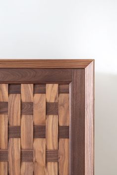 a close up of a wooden frame with wood squares on the front and back sides