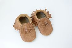 This all leather moccasins are perfect for busy toddlers.  Made from soft, deerskin leather.  Elastic in the ankle casing.  They are sewn together using a heavy, nylon thread. These moccasins measure 6 inches from heel to toe along the outside.  That allows for up to 5.5 inches of room on the inside for the foot.  I suggest allowing at least 1/2 inch of room initially for growing room (measure your child's foot as it's set firmly on the floor). Winona Mn, Grow Room, Wool Slippers, Busy Toddler, Leather Moccasins, Deer Skin, Slipper Socks, Toddler Sizes, Moccasins