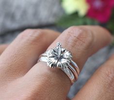 "Hibiscus Flower Rings Set of 3 details below: -Solid .925 sterling silver -Hibiscus measures 13mm x 11mm /Smooth Ring Band 1.2mm width -Choice of stack ring set -A: Boho Floral Band 3mm width/Bead band 1.2mm -B: Floral Leaf Band 3mm width/ Hammered band 1.2mm -Available in US sizes 1-11 with half sizes. *Single Hibiscus Ring here: https://www.etsy.com/listing/832806776/hibiscus-ring-hibiscus-flower-ring?frs=1 Looking for a last minute or unique Christmas gift? Visit our \"READY TO SHIP\" sectio Silver Stackable Flower Ring, Stackable Flower Sterling Silver Ring, Stackable Silver Flower Ring, Sterling Silver Flower Shaped Stackable Rings, Nature-inspired Flower Shaped Sterling Silver Rings, Sterling Silver Flower Stackable Rings For Wedding, Wedding Sterling Silver Stackable Flower Rings, Wedding Stackable Flower Rings In Sterling Silver, Hibiscus Ring