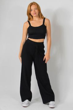 Sizing: *inseam may vary* DISCLAIMER: please note these pants have stretch and the measurements provided are prior to stretch X-Small - Waist: 22-24 inches Inseam: 27.5 inches Small - Waist: 23-25 inches Inseam: 27.5 inches Medium - Waist: 24-26 inches Inseam: 28.5 inches Large - Waist: 27-29 inches Inseam: 29 inches X-Large - Waist: 28-30 inches Inseam: 29.5 inches Material: 50% Viscose 30% Nylon 20% Polyester Imported Dry Clean Only MODEL DETAILS Model is wearing a small Model is 5'6 Model's w Black Elastane Bottoms For Loungewear, Black Elastane Pants For Loungewear, Chic Seamless Loungewear Bottoms, Black Elastane Lounge Pants, Knit Trousers For Loungewear, High Waist Black Ribbed Bottoms, Stretch Knit Full Length Pants, Casual Black Knit Bottoms, Trendy Wide Leg Knit Bottoms