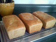 four pieces of bread sitting on top of a rack