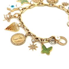 This 14K gold link bracelet features 11 charms and a diamond lobster clasp. Gold Link Bracelet, Gold Link, Link Bracelets, Lobster Clasp, Product Launch, Charm Bracelet, Charms, Bracelet, Wardrobe