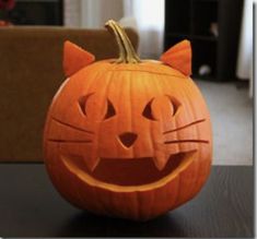 a carved pumpkin with a cat's face on it