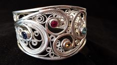 Woman Sterling Silver & Gemstone Cuff Bracelet, Sterling Silver Cuff Bracelet, Sterling Silver Filigree Cuff Bracelet, by FireandLaceJewelry on Etsy https://www.etsy.com/listing/224807951/woman-sterling-silver-gemstone-cuff Unique Filigree Bangle Cuff Bracelet, Elegant Silver Multi-stone Cuff Bracelet, Ornate Cuff Bracelet With Intricate Design For Anniversary, Ornate Sterling Silver Filigree Cuff Bracelet, Adjustable Sterling Silver Filigree Cuff Bracelet, Silver Multi-stone Cuff Bangle, Ornate Sterling Silver Cuff Bracelet Bangle, Ornate Sterling Silver Cuff Bracelet For Anniversary, Filigrana Jewelry