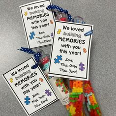 these are some colorful legos in plastic bags with writing on them that say we loved, building memories, and this year