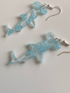 These adorable acrylic earrings glow in the dark. The sharks are about 1.5 inches! Calm Space, Shark Earrings, Jensen Beach, Acrylic Earrings, Dream Jewelry, Sharks, In The Dark, Glow In The Dark, Jewelry Earrings Dangle