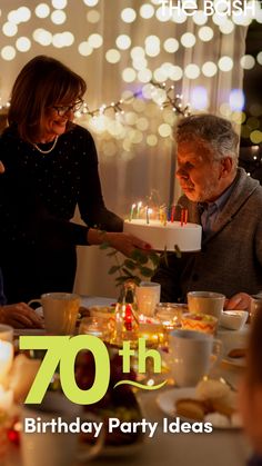 an old man and woman are celebrating their 70th birthday with candles on the cake in front of them