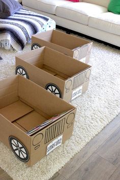 three cardboard boxes are sitting on the floor