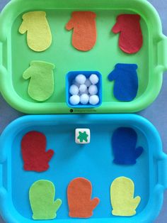 two plastic trays filled with different shapes and colors