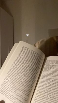 an open book sitting on top of a table