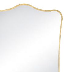 a white and gold framed mirror on a wall with an ornate border around the edge