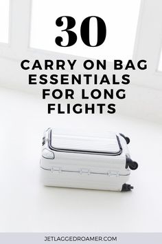 TEXT SAYS 30 CARRY ON BAG ESSENTIALS FOR LONG FLIGHTS. WHITE CARRY ON. Flight Carry On Essentials, Essentials For Long Flights, Long Flight Essentials, Extremely Dry Hands, Carry On Packing List, Airplane Packing, Airplane Tips, Surviving Long Flights, Long Flight Tips