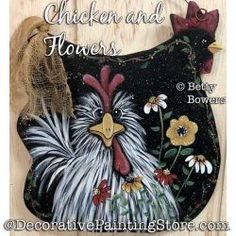 a chicken and flowers wall hanging on the side of a building