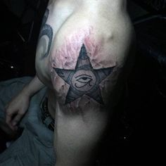 a man with a star tattoo on his chest