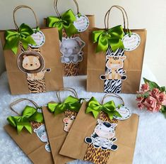 small brown bags with green bows and animals on them