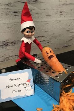 an elf is holding a carrot on top of a grater