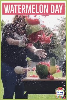 watermelon is being thrown into the air by a man in black shirt and white gloves