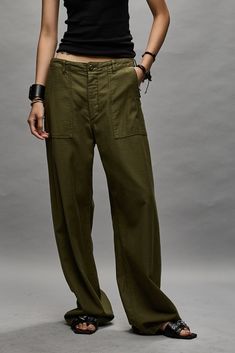 Utility pant with a wide leg. Made from Japanese surplus loose military sateen and treated with a softening enzyme wash. Color: Olive Model is 5'10 and wearing size 25 Bust 34”; waist 24”; hips 35” 100% Cotton R13WR077-R109B This style runs slightly large. If in between sizes, we recommend sizing down. R13 Denim, Military Chic, Long Sleeve Layering, Olive Pants, Pants Details, Utility Pants, Japanese Cotton, Denim Shoes, Linen Trousers