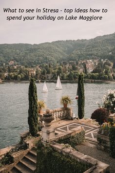 a lake with some trees and boats in the water